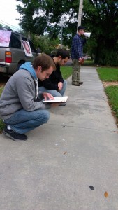 Students preaching the Gospel and praying.